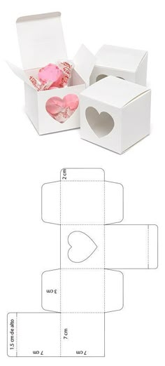 an open box with two hearts cut out from it and inside the box is shown