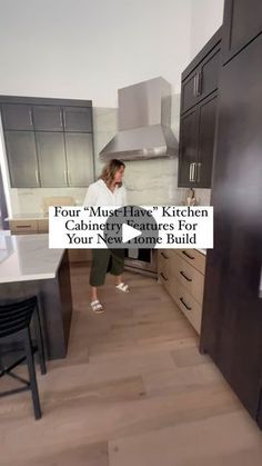 a woman standing in a kitchen with the words four must have kitchen cabinets for your new home build