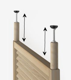 two screws are attached to the side of a wooden structure with three different angles