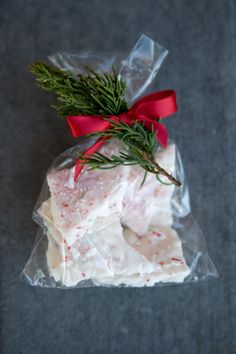 an image of food wrapped in plastic and tied with a red ribbon on the side