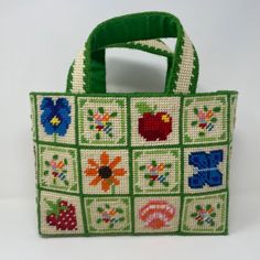 a green and white bag with flowers on it