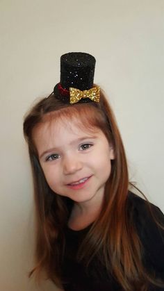 "Mini Ringmaster hat measures approx 3 1/2\" tall and approx 3\" diameter Perfect touch to the adorable romper shown here made by the shop everafterfairytales..romper not included in this listing... Elastic headband sized to fit adult or child..please leave a note at checkout regarding age of Child Made from our non shedding super sparkly glitter material" Adjustable Round Crown Mini Hats For Birthday, Adjustable Mini Hats With Round Crown For Birthday, Adjustable Mini Hats With Round Crown For Birthdays, Whimsical Adjustable Mini Hats For Birthdays, Cute Party Mini Hats, One Size Fits Most, Whimsical Adjustable Costume Hats For Birthday, Cute Party Mini Hats One Size Fits Most, Cute Mini Cap Hats For Party, Novelty Mini Hats For Birthday