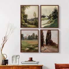 three paintings hang on the wall above a dresser