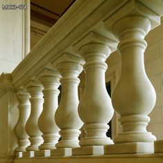 an image of some white pillars and railings