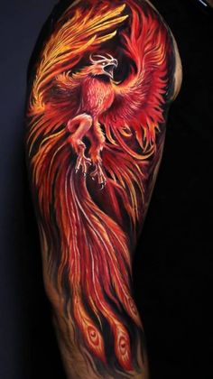 a man with a tattoo on his arm has a red and yellow firebird on it