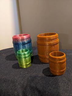 three wooden barrels sitting on top of a table