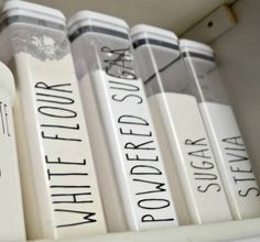 several white books are lined up on a shelf