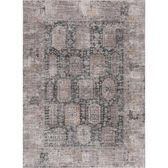 an area rug with various colors and patterns on the floor, including grays, browns,