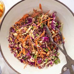 a white bowl filled with coleslaw and carrots