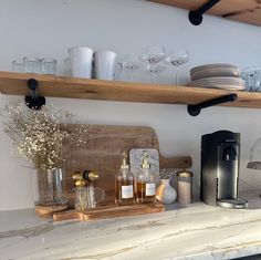 the kitchen counter is clean and ready to be used for dishes, cups, and other things