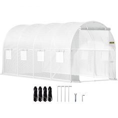 an image of a white greenhouse with the door open and some wires attached to it