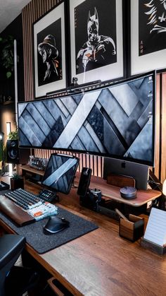 a wooden desk topped with a laptop computer next to a monitor and mouse on top of it