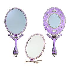 two purple mirrors sitting next to each other