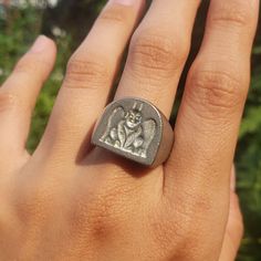 This signet ring is cast in lead-free pewter. The ring size when cast is 7.25. The sealing image is a gargoyle.       This is part of a series of signet rings I am making cast from lead-free pewter. Each master ring is hand sculpted to give a unique, rustic style, multi-dimensional relief image when used as a stamp to seal, with sealing wax. Gargoyle Ring, Wax Seal Ring, Face Wax, Pewter Ring, Resize Ring, Power Ring, Signet Rings, Multi Dimensional, Sealing Wax