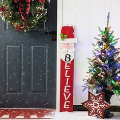 two christmas wreaths are on the front door