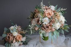 two vases filled with different types of flowers