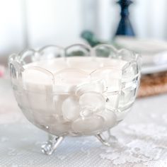 a glass bowl sitting on top of a table