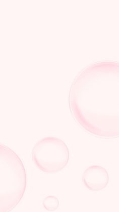 three bubbles floating in the air on a white background with pink hues and shadows