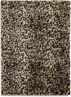 an animal print rug with black and white spots