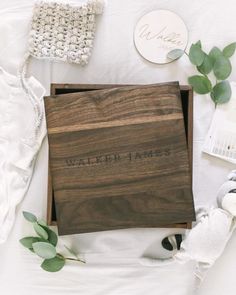 a wooden box with the word walked james on it and some other items surrounding it