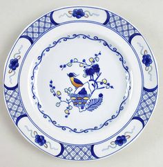 a blue and white plate with birds on it