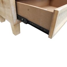 a close up of a wooden table with drawers on the bottom and one drawer open