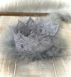 Thank you for supporting my small business! 💗  Follow me here and on Instagram.  What a great way to make a little one OR adult, feel like a princess or prince!! 👸🤴I have 6 lace crown styles.  Some are great for boys! Beautiful, hand made lace crowns.  Perfect for newborn photos, special occasions, birthdays and photo ops.  Add feathers, rhinestones, and/or a glitter birthday number! I make different crown designs and colors, giving you the option of simple to fancy. 💎  I also make 21-inch crowns for adults.  Check out my other listings in my Lace Crowns category! The venice lace is stiffened with a non-toxic fabric product. I DON'T  PAINT THE LACE. I secure a chenille stem around the crown base to help retain its shape. All crowns are 4 inches wide (12 inches diameter).  The lace size Crown Styles, Silver Crowns, Newborn Crown, First Birthday Crown, Lace Crown, Feather Crown, Lace Crowns, Mini Crown, Glitter Birthday