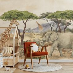 an elephant and giraffe mural in a child's room with a red chair