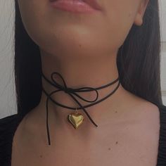 "The Keke Suede String Heart Necklace 🤍 *all photos owned by me!* Featuring a stainless steel puffy heart pendant, and a 48\" cut suede string cord. There are a ton of ways to wear this necklace (you can even wear it as a waist belt!) and if you need a custom length, DM me!  Choose between gold and silver at checkout  Unisex & tarnish proof 🖤 Made with love 🫶" Cord Heart Necklace, Chunky Heart Necklace, Goth Love, String Heart, Suede Cord Necklace, Elegant Goth, Necklace String, String Necklace, Black Cord Necklace