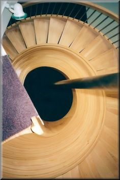 an aerial view of a wooden spiral staircase