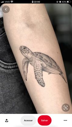 a small turtle tattoo on the left forearm and arm, with an inking technique