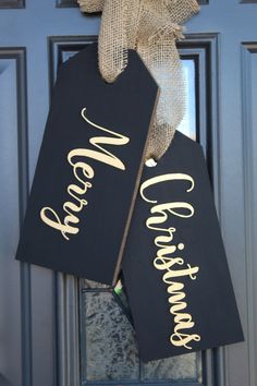 two black and gold welcome home signs hanging on a blue door with burlock