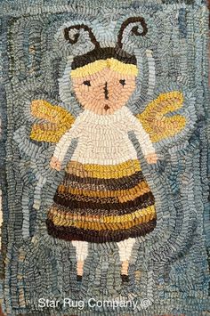 a close up of a mosaic with a bee on it