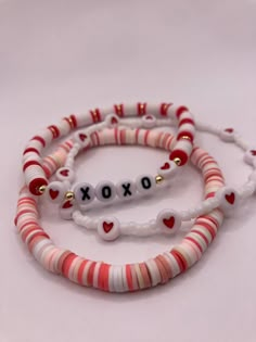 The Valentine's Day stack comes with 7 bracelets-- four seed bead bracelets and 3 clay heishi bead bracelets.  Handmade with love and care and shipped from central Texas ️ Red And White Clay Bead Bracelet, Clay Bead Bracelet Ideas With Gold Beads, Clay Bead Bracelets For Couples, Clay Bracelet Color Ideas, Seed Bead And Clay Bead Bracelets, Bead Bracelets Clay, Bracelet Ideas Valentines Day, Bracelets Inspo Clay Beads, Clay Need Bracelets