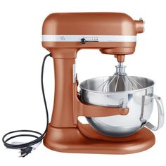 an orange stand mixer on a white background