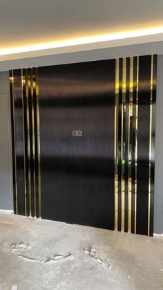 an open garage door with black and gold stripes