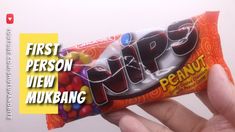 a person holding up a candy bar with the word flip written on it in front of them