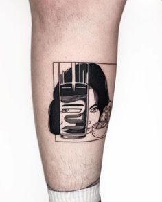 a woman's face is reflected in a mirror on her leg