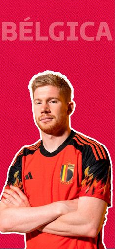 a man with his arms crossed standing in front of a red background and the words belgica on it