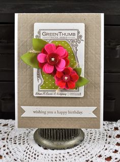 a close up of a card with flowers on it