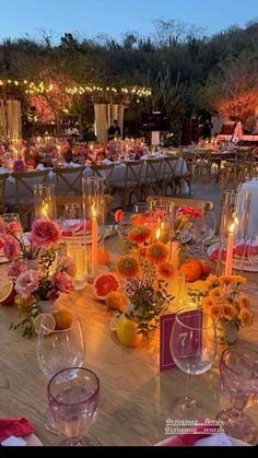 the table is set with candles and flowers