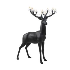 a black deer figurine with lights on it's antlers is shown