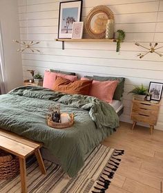 a bed sitting in a bedroom on top of a wooden floor