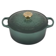 le creuset cast iron covered casserole in green with gold knobs