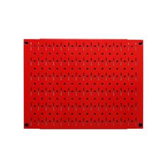 a red peg board with holes on it