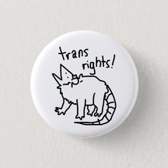 a white button with the words transs rights written on it and an image of a rat