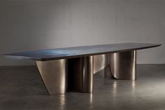 a long metal table sitting on top of a floor