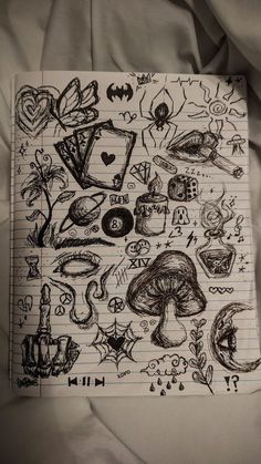 a sheet of paper with drawings on it and some other things in the background that are drawn