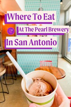 someone holding up a bowl of ice cream with the words where to eat at the pearl brewery in san antonio