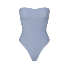 This double layered strapless thong bodysuit in our buttery-soft fabric is an essential addition to every closet. Inner elastic at the top helps keep it in place all day, while optional bra straps keep it versatile. Features a flattering high cut leg opening and a cotton gusset with snaps for ease. Fits true to size. | SKIMS Strapless Bodysuit | Blue | 4XL | Fits Everybody Strapless Bodysuit, Blue Bodysuit, Bra Straps, High Cut, Soft Fabric, Soft Fabrics, Lounge Wear, Elastic, Bra